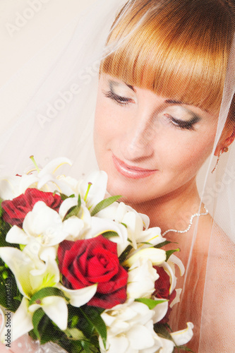 Close-up portrait of young bride with the veil.