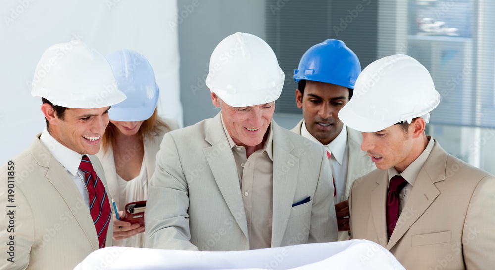 A group of architect discussing a construction plan A group of architect discussing a construction plan