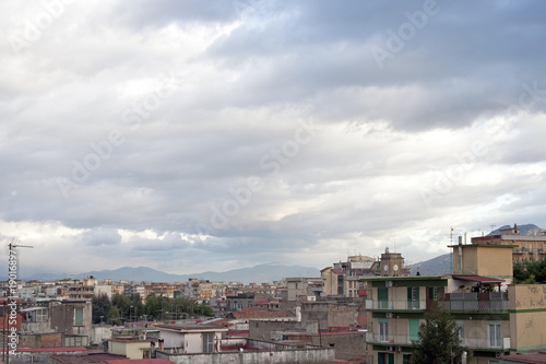 Sky and buildings with Vesuvius, Naples outskirts, Italy