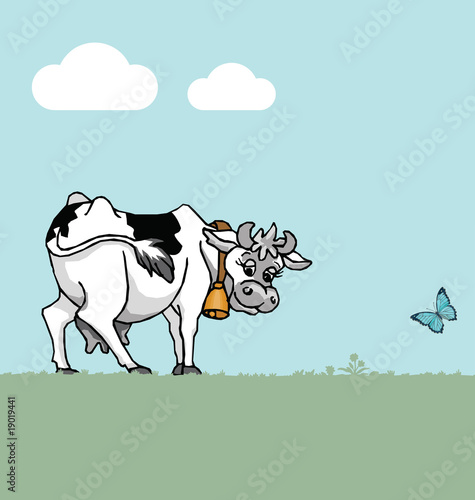 Cow in field with blue sky and clouds
