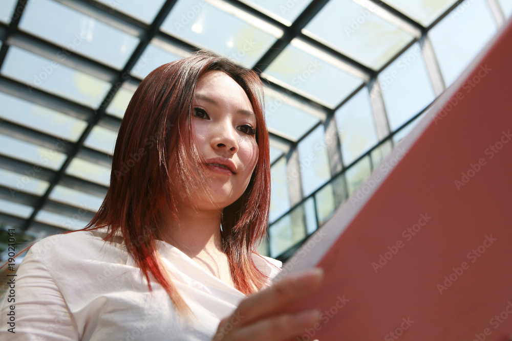 young asian businesswomen holding with document young asian businesswomen holding with document