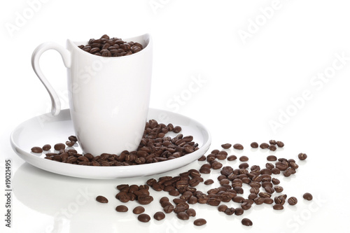 Cup, plate and coffee in grains