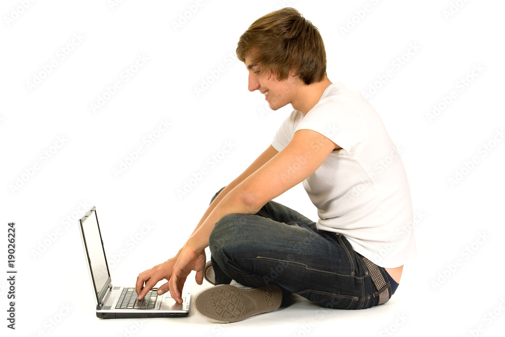 Naklejka premium Young man using laptop