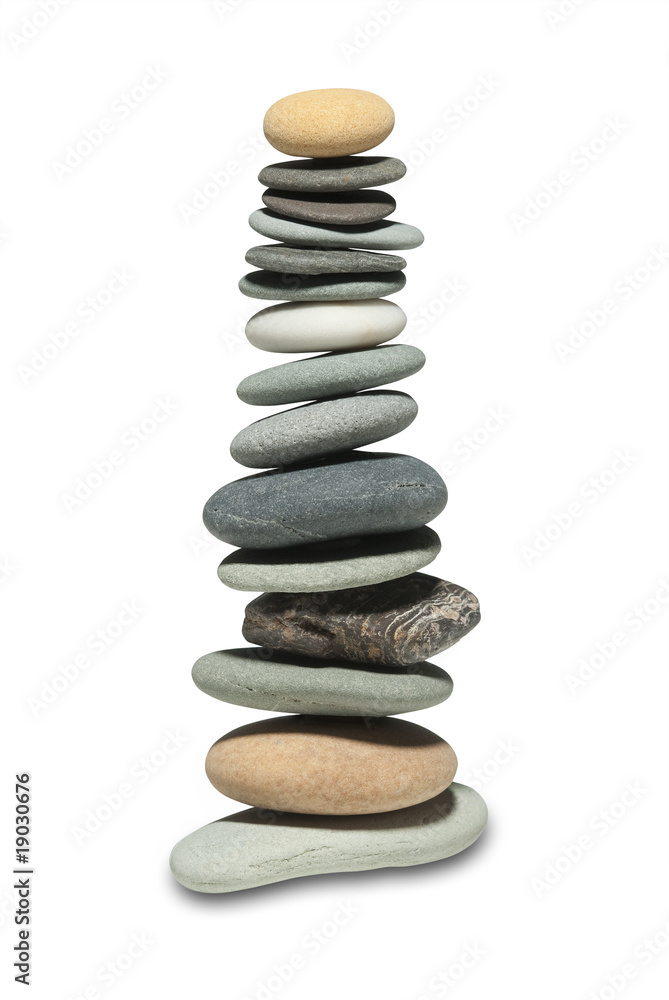 River stones balanced precariously by zen forces River stones balanced precariously by zen forces