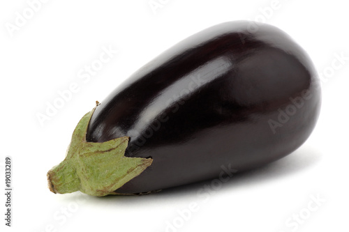 Single aubergine on white background.