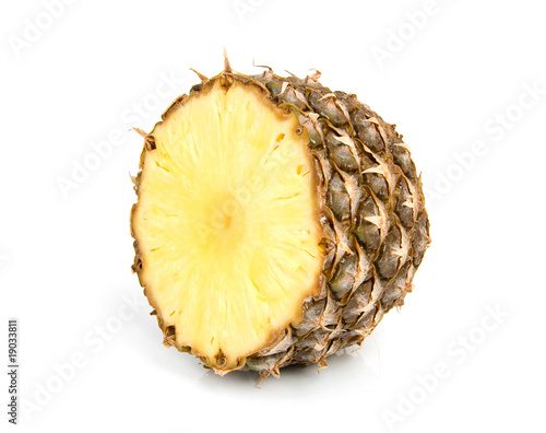 Half pineapple over white background