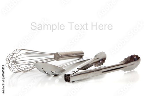 Quadro su tela Silver kitchen utensils on white with copy space