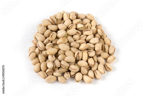 salted pistachios isolated on white background