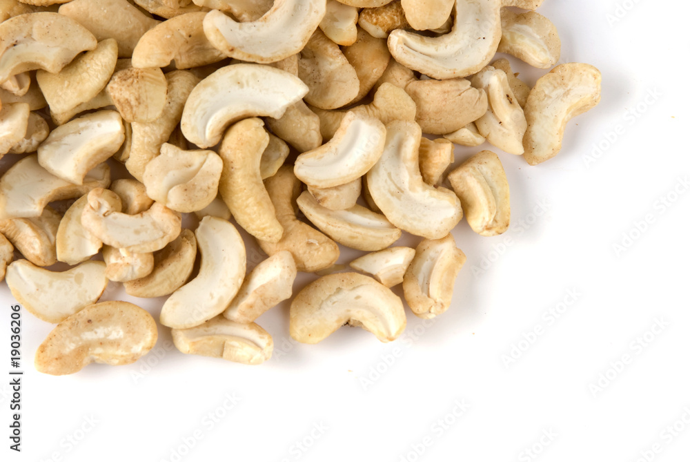 Pile of cashew nuts in isolated white background Pile of cashew nuts in isolated white background
