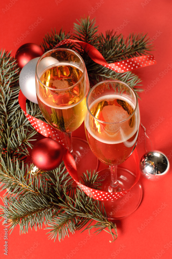 Two glasses of champagne and a New Year's decoration Two glasses of champagne and a New Year's decoration