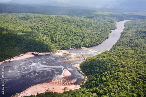 Aerial view on tropical forest river photo