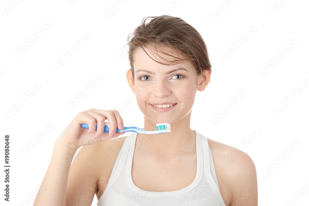 Young girl brushing her teeth happily Young girl brushing her teeth happily
