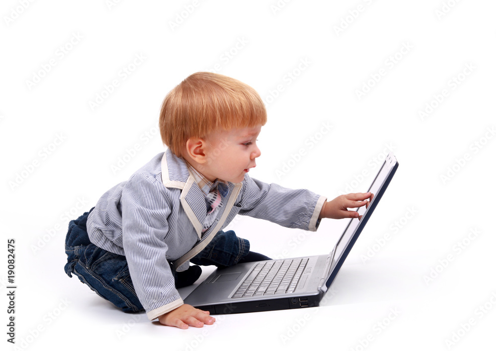Little child and laptop Isolated on white background. Little child and laptop Isolated on white background.