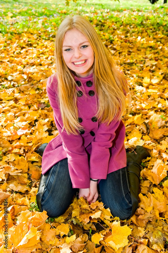 portrait of young smiling woman on the ground