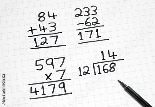 Wallpaper Mural Writing simple maths sums on square paper. Torontodigital.ca