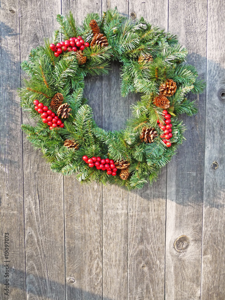 Christmas wreath on a rustic wooden background Christmas wreath on a rustic wooden background