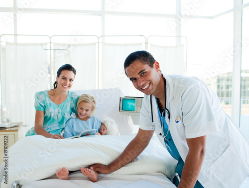 Male doctor smiling at the camera