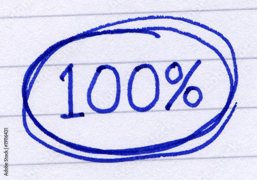 Фотография 100 percent circled, written in blue ink on white paper.