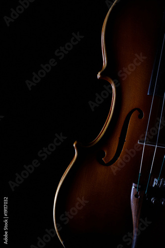 vintage violin over dark background photo