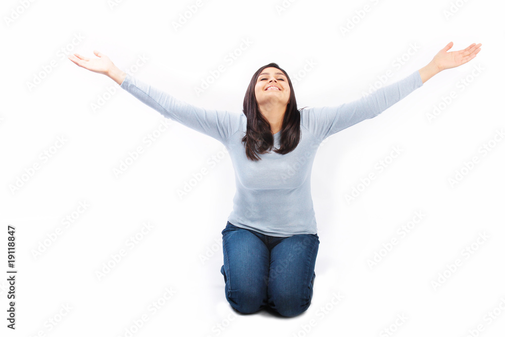 Young woman on her knees with arms raised up Stock Photo Adobe Stock