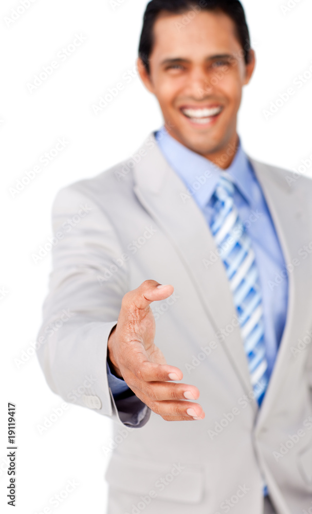 Confident businessman reaching out to shake hands Confident businessman reaching out to shake hands