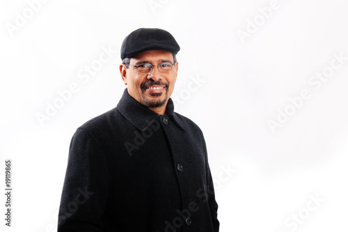 Isolated smiling middle age hispanic man © Monart Design