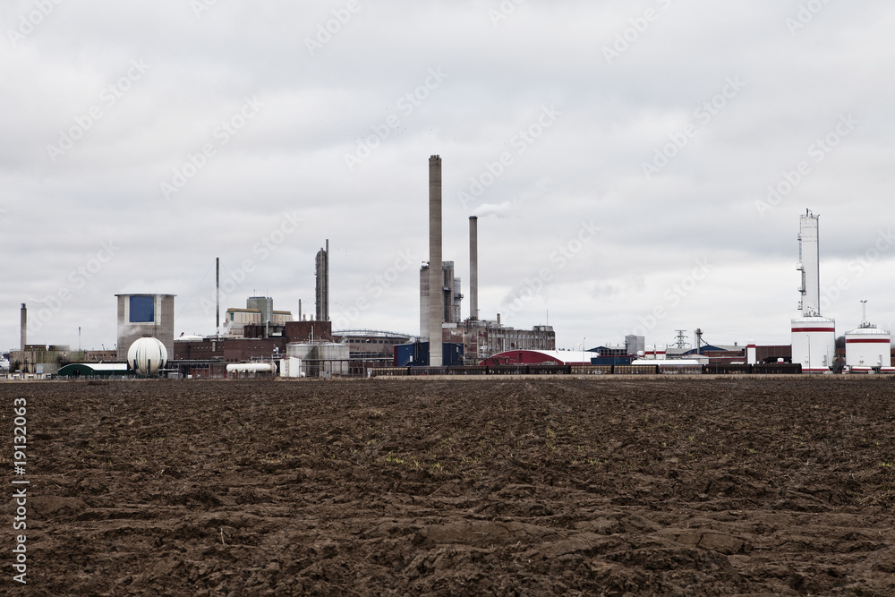 Industrial buildings behind a field