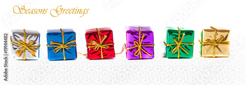 seasons greetings christmas presents white background