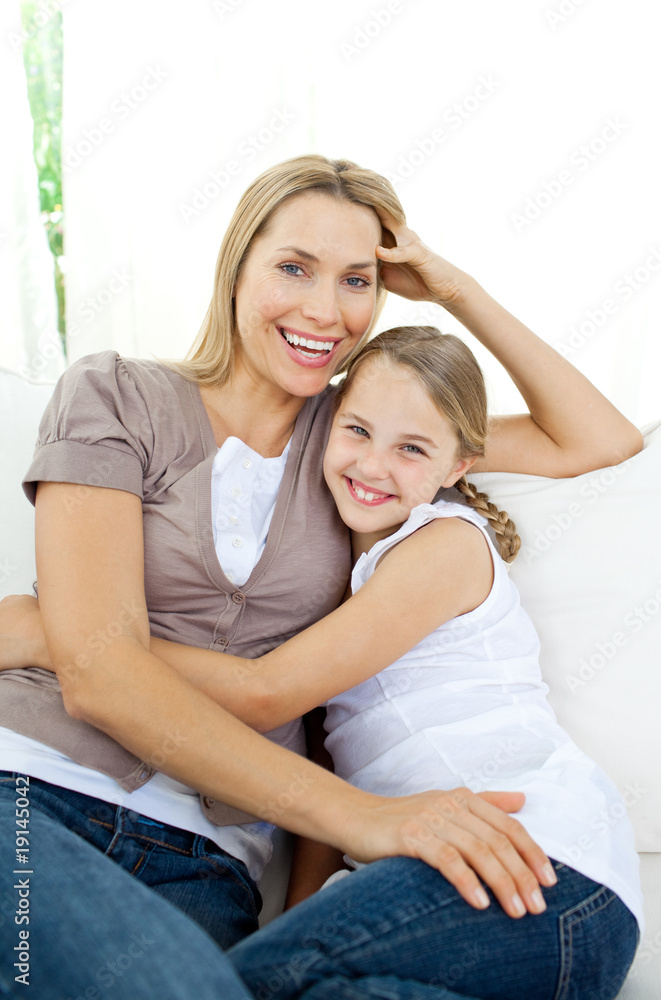 Beautiful little girl hugging her smiling mother Beautiful little girl hugging her smiling mother