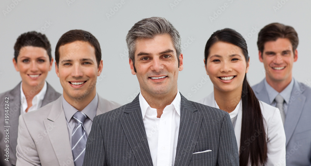 Multi-ethnic business team standing together Multi-ethnic business team standing together
