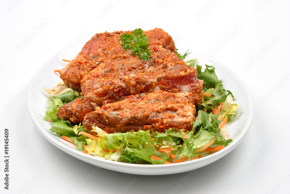 some marinated organic rib on healthy salad some marinated organic rib on healthy salad