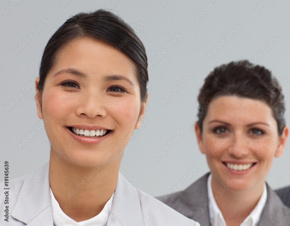 Smiling Business co-workers standing in a line Smiling Business co-workers standing in a line