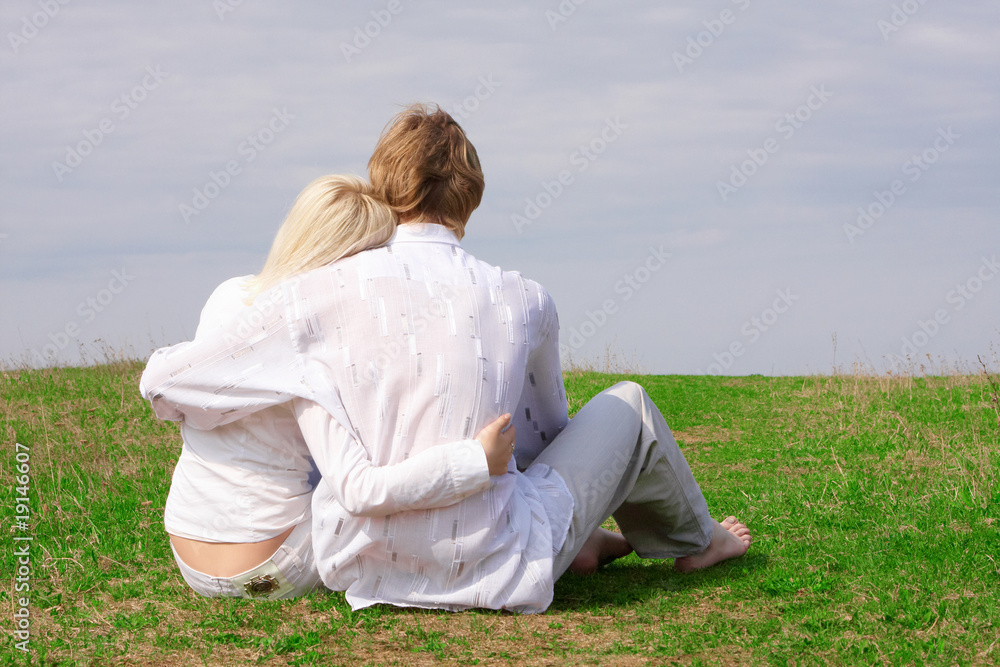 Guy and girl sitting on the ground Guy and girl sitting on the ground