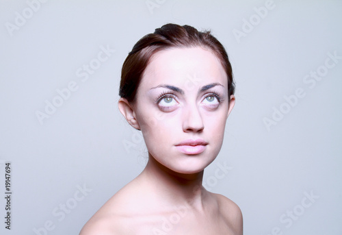 Portrait of a beautiful woman looking up