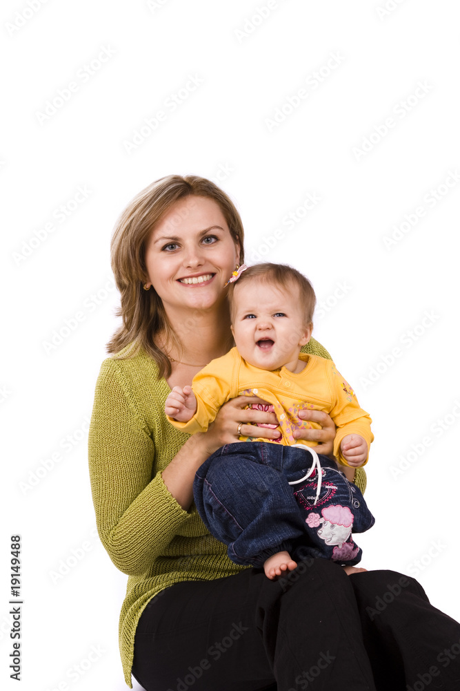 Happy family - mother and little daughter are embracing . Happy family - mother and little daughter are embracing .