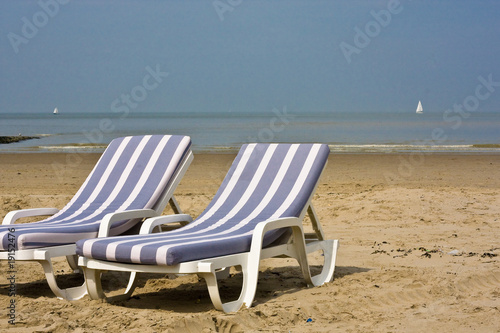 blue chairs at beach