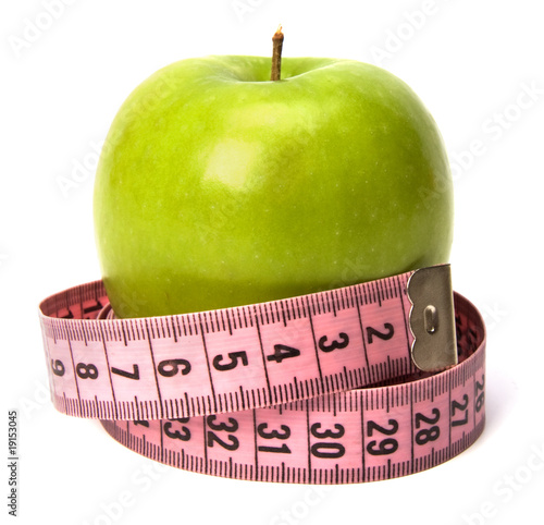 tape measure wrapped around the apple isolated on white backgro