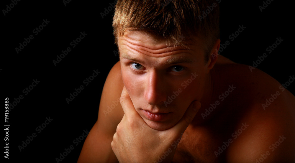 Obraz premium close-up portrait of young good looking male model.
