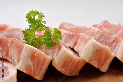 some raw organic pork chop and parsley