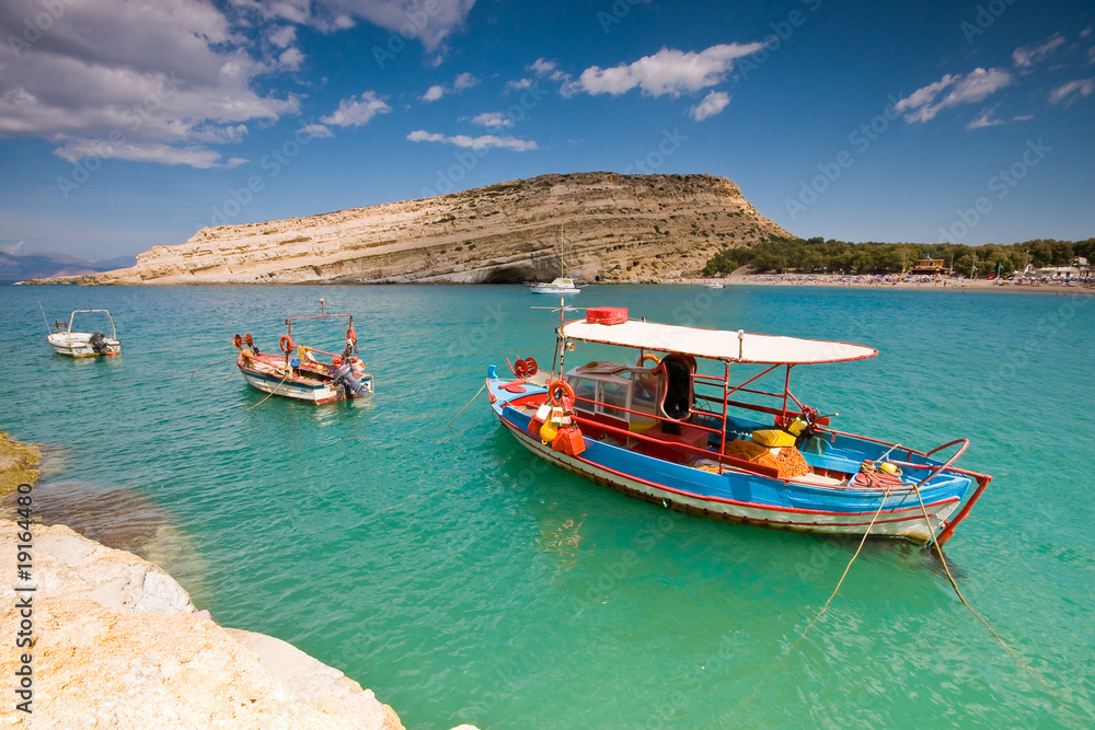 Fishing boat anchored in Matala bay, Crete, Greece