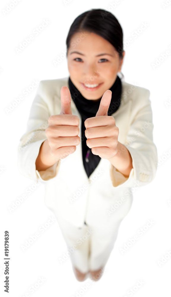 Successful young businesswoman with thumbs up Successful young businesswoman with thumbs up