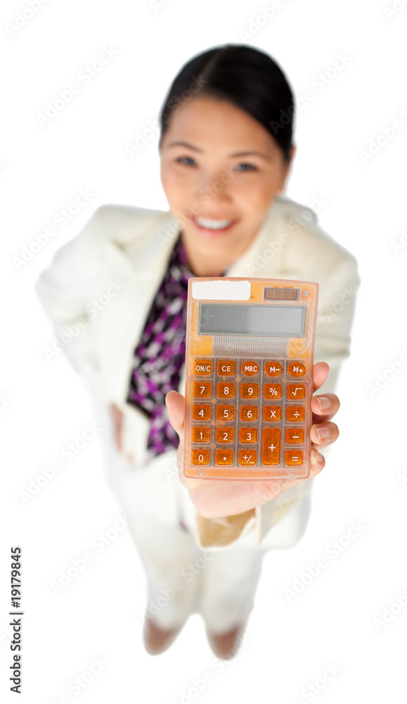 Smiling young businesswoman holding a calculator Smiling young businesswoman holding a calculator