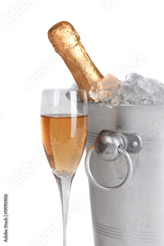 Champagne and ice bucket isolated on white