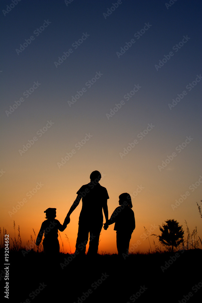 mater and children - silhouette by sunset