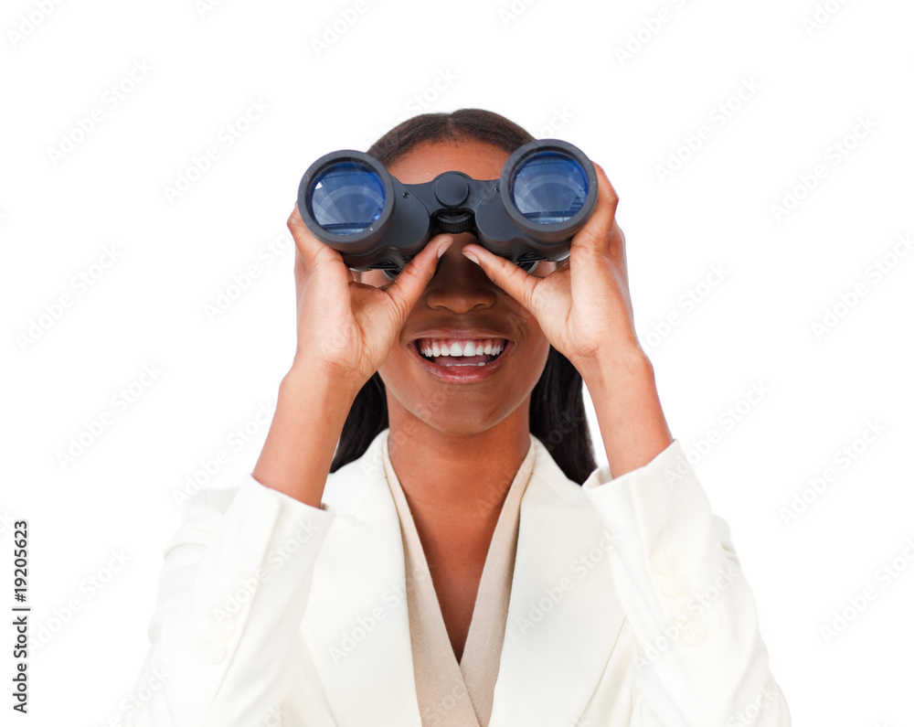 Visionary businesswoman looking through binoculars Visionary businesswoman looking through binoculars
