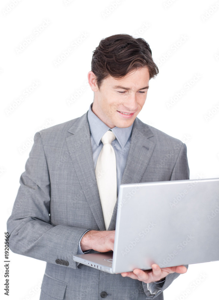 Positive businessman using a laptop Positive businessman using a laptop