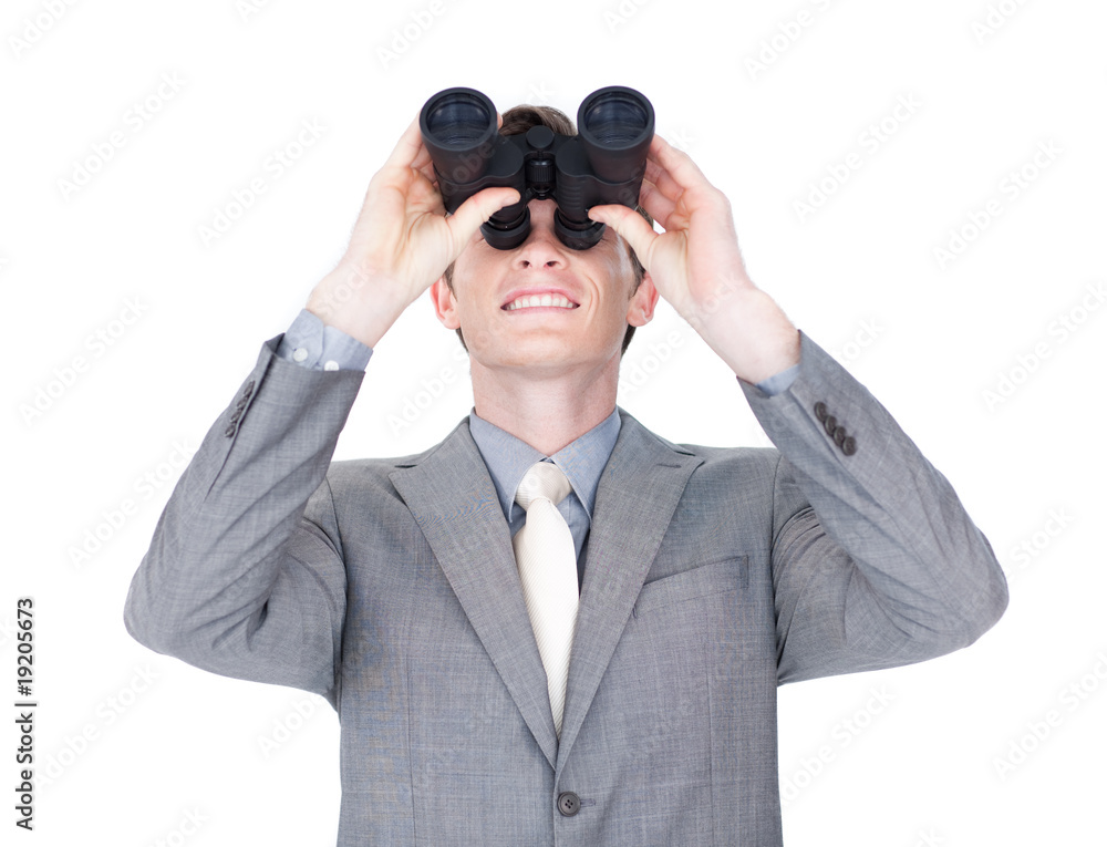 Young businessman looking up through binoculars Young businessman looking up through binoculars