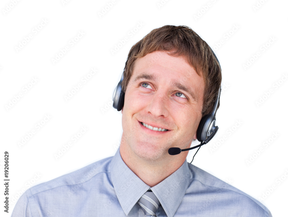 Young businessmnan with headset on looking up Young businessmnan with headset on looking up