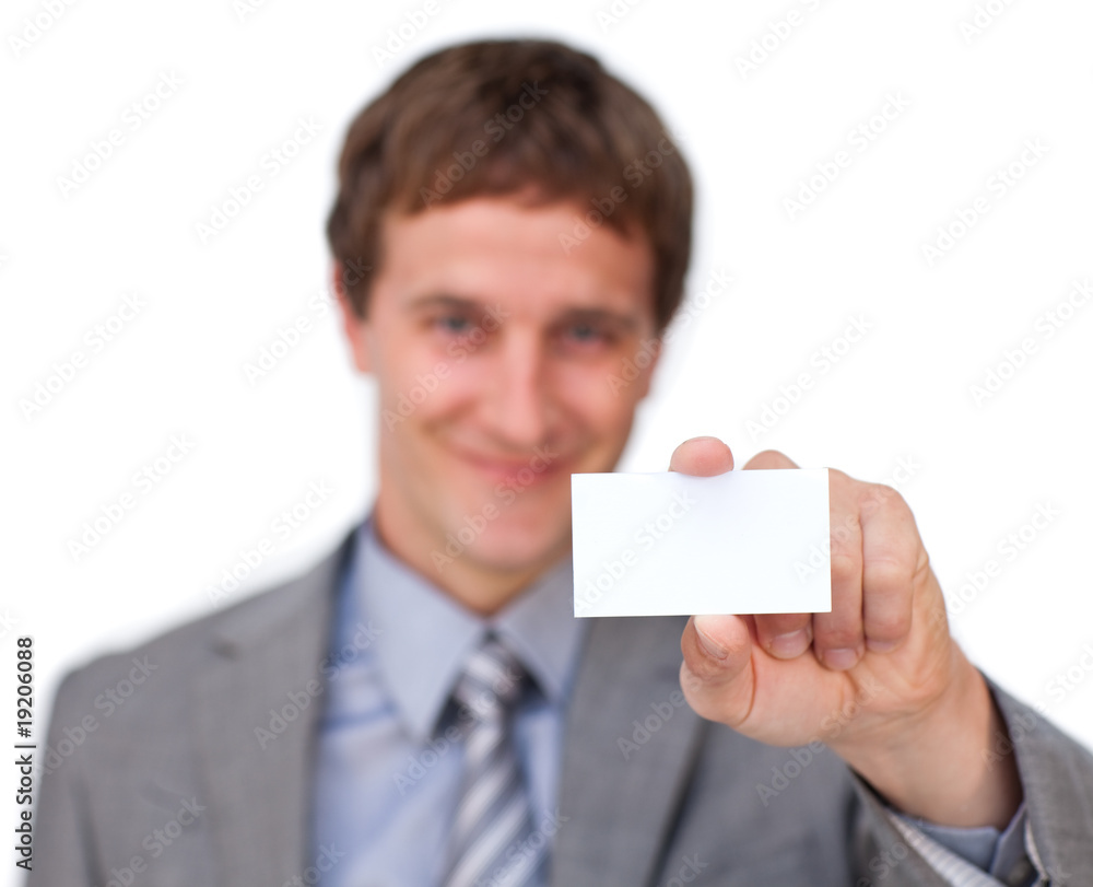 Blond businessman showing a white card Blond businessman showing a white card