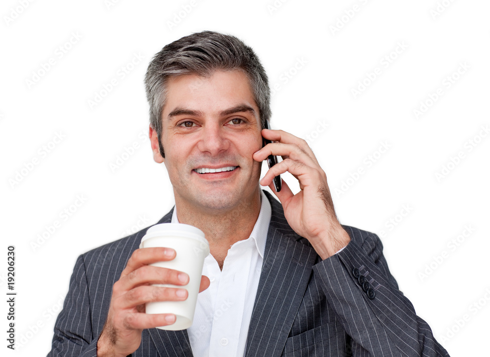 Confident Businessman on phone while drinking a coffee Confident Businessman on phone while drinking a coffee